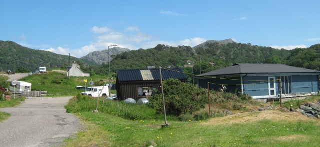 sheds, houses and vans spread across the hillside